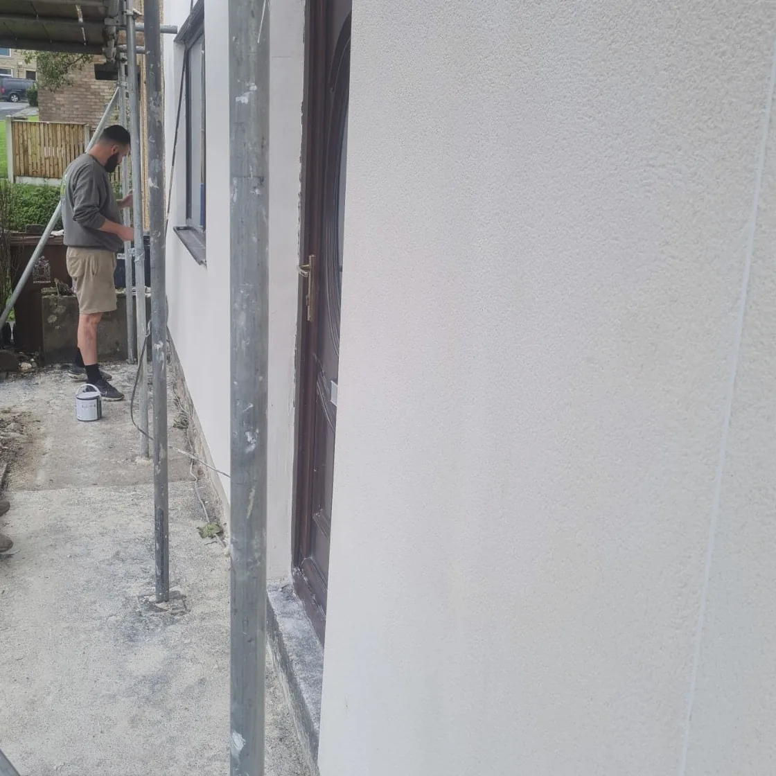 Exterior render finishing with scaffolding alongside