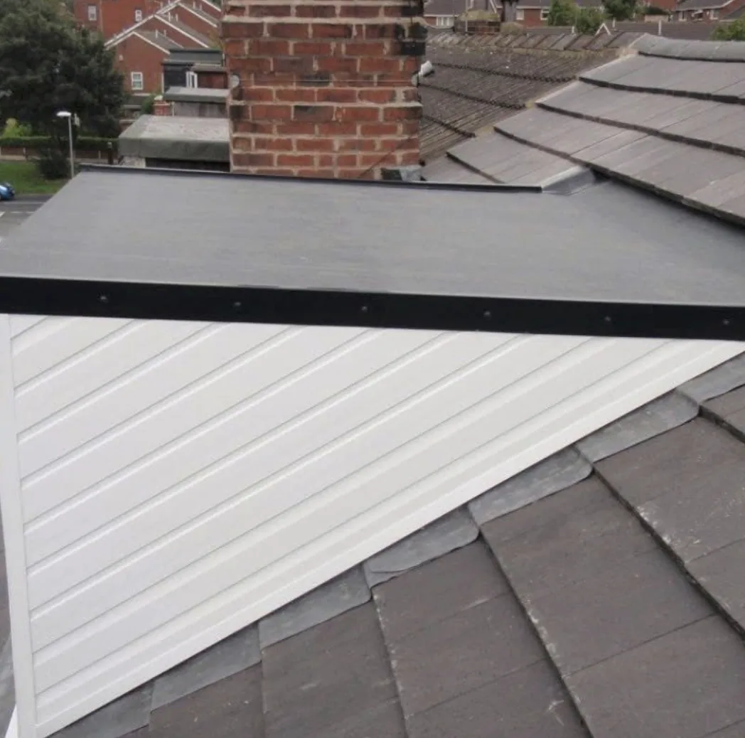 Flat roof above white dormer cladding
