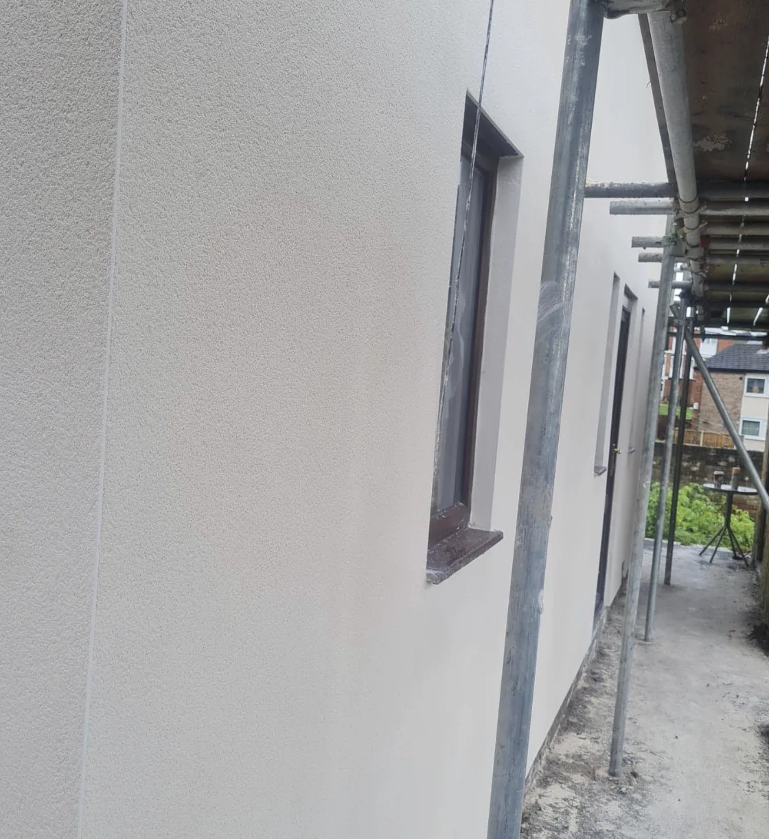Exterior render and window reveals beneath scaffolding