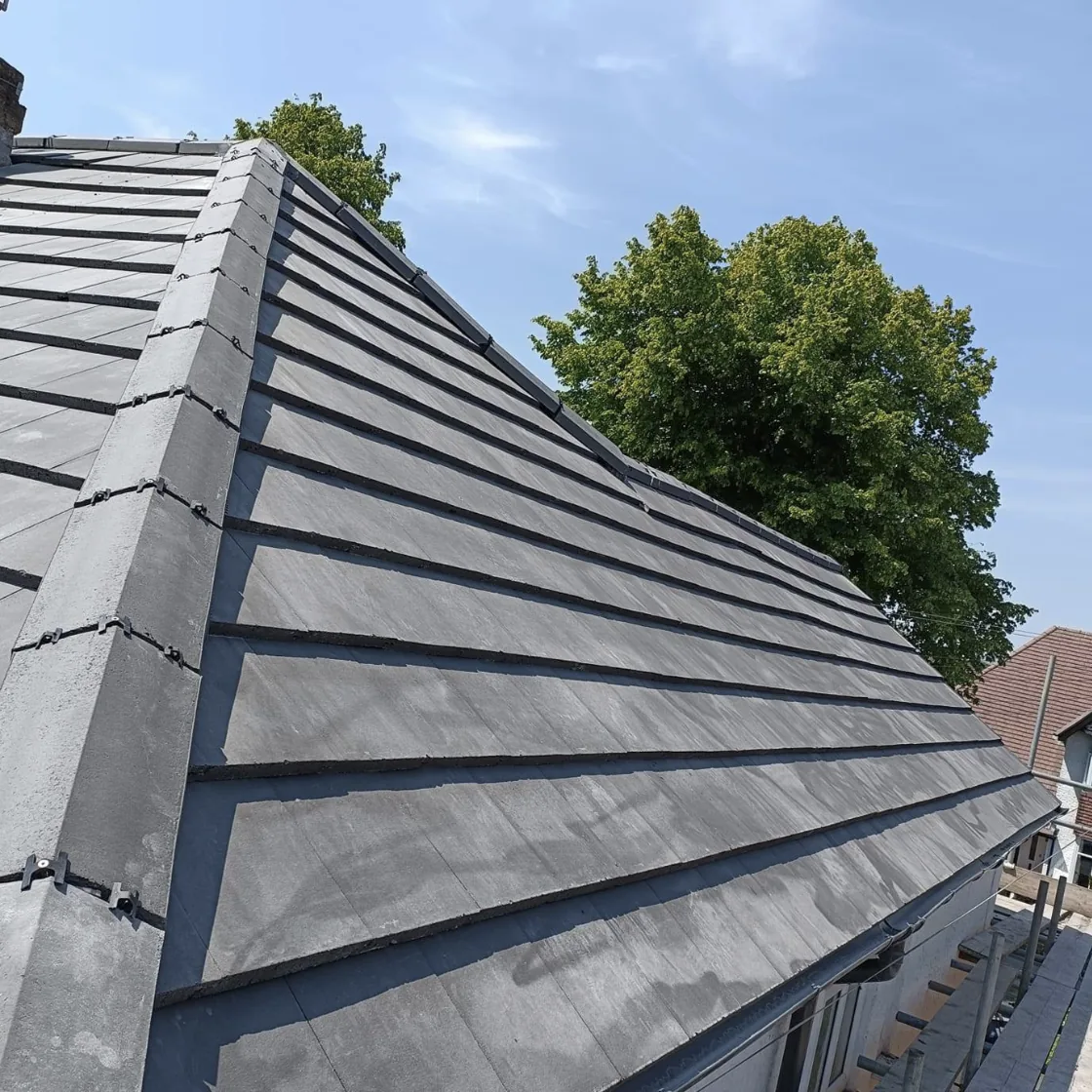 Grey roof tiles and a finished hip line